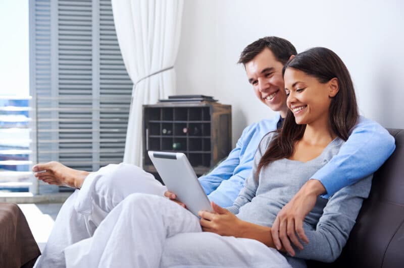 couple reading real estate newsletter